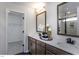 Elegant bathroom with double vanity, contemporary fixtures, and access to a walk-in closet at 33 White Azalea Way, Homesite 80, Benson, NC 27504