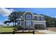 Beautiful two-story home with stone accents and a spacious two-car garage at 33 White Azalea Way, Homesite 80, Benson, NC 27504