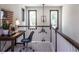 Comfortable home office nook with a desk, stylish chair, and natural light from the windows at 33 White Azalea Way, Homesite 80, Benson, NC 27504