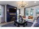 Bright living room featuring a dark accent wall, recessed lights, and large windows at 33 White Azalea Way, Homesite 80, Benson, NC 27504