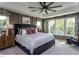 Spacious main bedroom featuring a tray ceiling, a ceiling fan, and large windows with natural light at 33 White Azalea Way, Homesite 80, Benson, NC 27504