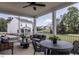 This porch features an outdoor ceiling fan and overlooks views of the neighborhood at 33 White Azalea Way, Homesite 80, Benson, NC 27504
