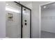 This shower features sleek black hardware, modern fixtures, and a convenient built-in shampoo niche at 33 White Azalea Way, Homesite 80, Benson, NC 27504