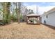 The home has a spacious backyard, with a covered deck and additional shed for storage at 3650 Durwood Ln, Raleigh, NC 27604