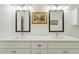 Bright bathroom with double vanity, white marble counters and tile floors at 3650 Durwood Ln, Raleigh, NC 27604