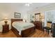 Comfortable bedroom with wooden floors, natural light and a ceiling fan at 3650 Durwood Ln, Raleigh, NC 27604
