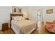 Cozy bedroom featuring hardwood floors, a comfortable bed and access to ensuite bathroom at 3650 Durwood Ln, Raleigh, NC 27604