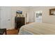 Comfortable bedroom with wooden floors and an ensuite bathroom at 3650 Durwood Ln, Raleigh, NC 27604