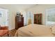 Comfortable bedroom featuring a wood cabinet and neutral color scheme at 3650 Durwood Ln, Raleigh, NC 27604