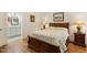 Comfortable bedroom with wooden floors and an ensuite bathroom at 3650 Durwood Ln, Raleigh, NC 27604