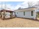 A cozy home has neutral siding and a covered deck that is perfect for relaxing at 3650 Durwood Ln, Raleigh, NC 27604
