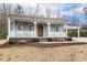 Charming home with a welcoming front porch and updated landscaping at 3650 Durwood Ln, Raleigh, NC 27604