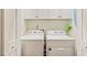 Bright laundry room features washer and dryer at 3650 Durwood Ln, Raleigh, NC 27604