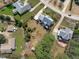 Aerial view of the house and surrounding neighborhood with mature trees and yards at 3708 Wesley Ridge Dr, Apex, NC 27539