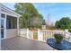 Outdoor deck overlooking landscaped backyard with lush greenery and a charming garden at 3708 Wesley Ridge Dr, Apex, NC 27539