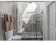 Stunning bathroom boasts a frameless glass shower with a built-in bench and modern tiling at 3708 Wesley Ridge Dr, Apex, NC 27539