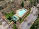 Aerial view of the community pool and parking lot in a wooded area at 3708 Wesley Ridge Dr, Apex, NC 27539