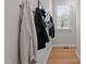 Hallway features a clothing rack and hardwood floors at 3708 Wesley Ridge Dr, Apex, NC 27539