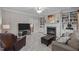 Living room features a fireplace, soft natural light, and comfortable seating at 3708 Wesley Ridge Dr, Apex, NC 27539