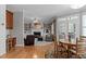 Open floor plan featuring an eat-in kitchen adjacent to the main living space and fireplace at 3708 Wesley Ridge Dr, Apex, NC 27539