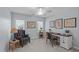 Bright office featuring built-in desk, natural light, and stylish furnishings to create an efficient workspace at 3708 Wesley Ridge Dr, Apex, NC 27539