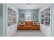 Cozy sitting area with built-in bookshelves and a window seat, creating a relaxing and inviting space at 3708 Wesley Ridge Dr, Apex, NC 27539