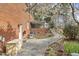 Beautiful backyard featuring a well-manicured lawn, mature trees, and walkway at 3715 Rawls Church Rd, Fuquay Varina, NC 27526