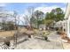 Expansive backyard with mature trees, bench seating, and a playset for outdoor fun at 3715 Rawls Church Rd, Fuquay Varina, NC 27526