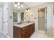 Bright bathroom features a granite countertop, double vanity, and walk-in shower at 3715 Rawls Church Rd, Fuquay Varina, NC 27526