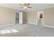 Bedroom featuring neutral walls, carpet and multiple doorways to other parts of the house at 3715 Rawls Church Rd, Fuquay Varina, NC 27526