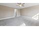 Bedroom featuring neutral walls, carpet and large windows that provide lots of natural light at 3715 Rawls Church Rd, Fuquay Varina, NC 27526