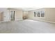 Large bonus room with neutral carpet, stairs, and a window at 3715 Rawls Church Rd, Fuquay Varina, NC 27526