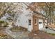 Charming home exterior with brick accents, white siding, and lush landscaping at 3715 Rawls Church Rd, Fuquay Varina, NC 27526