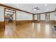 Spacious living room with hardwood floors, wood trim and paneled walls at 3715 Rawls Church Rd, Fuquay Varina, NC 27526
