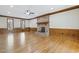 Spacious living room features hardwood floors, brick fireplace, ceiling fan and decorative wood trim at 3715 Rawls Church Rd, Fuquay Varina, NC 27526