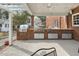 Covered patio featuring a built-in outdoor kitchen with grill and ample counter space at 3715 Rawls Church Rd, Fuquay Varina, NC 27526