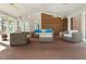 Large covered patio with brick flooring, wicker furniture, and white columns at 3715 Rawls Church Rd, Fuquay Varina, NC 27526