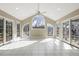 Sunroom featuring tile floors, and many windows that let in ample natural light at 3715 Rawls Church Rd, Fuquay Varina, NC 27526