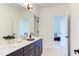 Bathroom featuring double sinks and black hardware at 3901 Laurel Creek Ln, Wake Forest, NC 27587