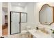 Bathroom featuring subway tile shower, glass door and luxurious vanity at 3901 Laurel Creek Ln, Wake Forest, NC 27587