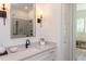 Elegant bathroom features a modern vanity with quartz countertop and black faucet at 3901 Laurel Creek Ln, Wake Forest, NC 27587