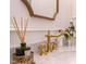 Bathroom vanity with marble countertop and gold faucet at 3901 Laurel Creek Ln, Wake Forest, NC 27587
