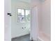 Bathroom features black slate floors and a shower/tub with subway tile surround and curtain at 3901 Laurel Creek Ln, Wake Forest, NC 27587
