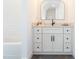 Bathroom vanity boasts marble countertop, modern black hardware and a subway tiled tub at 3901 Laurel Creek Ln, Wake Forest, NC 27587