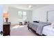 Cozy bedroom features a ceiling fan, window, and a comfortable bed at 3901 Laurel Creek Ln, Wake Forest, NC 27587