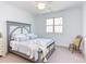 Bedroom features a bed with decorative pillows and a window at 3901 Laurel Creek Ln, Wake Forest, NC 27587