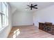 Bright bedroom featuring a ceiling fan, large window, and beautiful hardwood floors at 3901 Laurel Creek Ln, Wake Forest, NC 27587