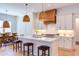 Spacious kitchen with a large center island, pendant lighting, and stainless steel appliances at 3901 Laurel Creek Ln, Wake Forest, NC 27587