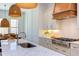 Stylish kitchen featuring a marble island, custom cabinetry, and an eat-in dining area at 3901 Laurel Creek Ln, Wake Forest, NC 27587