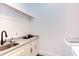 Laundry room with granite countertops, cabinetry, sink, and modern appliances at 3901 Laurel Creek Ln, Wake Forest, NC 27587